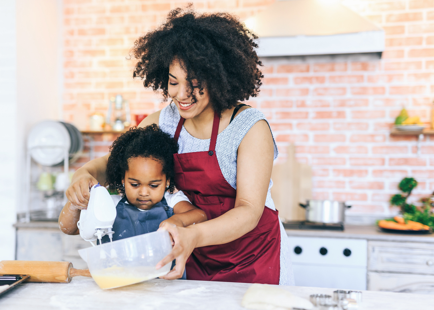 Mother and child cooking together